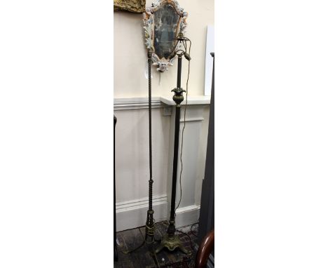 A French brass standard lamp, late 19th/early 20th century with ropetwist column and tripod base terminating in anthemion fee