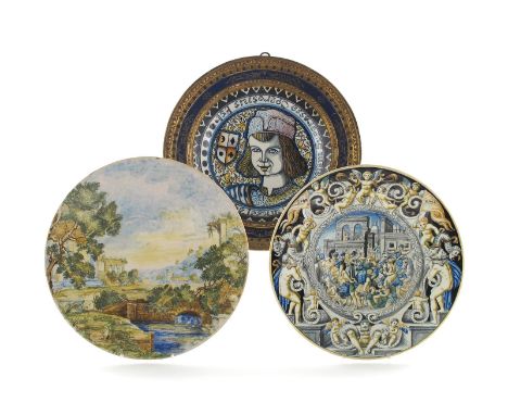Three Italian maiolica dishes, early 20th century, two by Vincenzo Molaroni of Pesaro, one painted with a scene depicting the