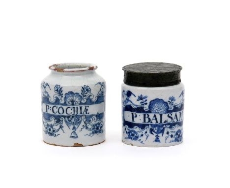 Two small delftware cylindrical pill jars, early 18th century, both painted with winged putti flanking flower stems and large