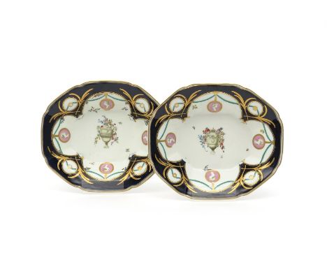 A good pair of Chelsea Derby dishes, c.1765-70, the elongated octagonal forms painted with central urns draped in flower garl