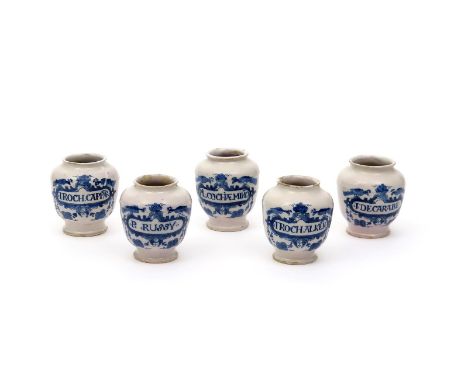 A rare set of five London delftware dry drug or pill jars, c.1720, painted in blue with peacocks flanking baskets of fruit ab