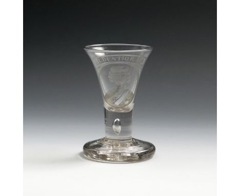 A Jacobite portrait firing glass, c.1740, the trumpet bowl rising from a short teardrop stem and engraved with the head and s