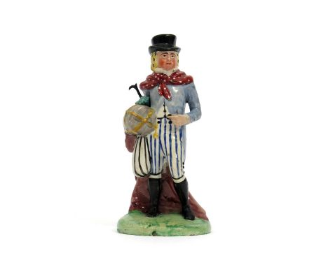A Salt pearlware theatrical figure of John Liston, c.1820, dressed as Lubin Log, wearing striped breeches, with a red spotted