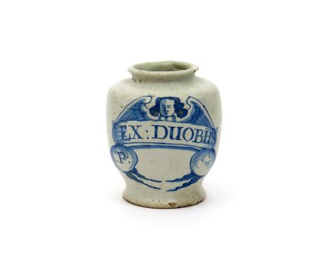 An early delftware dry drug or pill jar, c.1680, painted in blue with an angel with oustretched wings above a banner inscribe