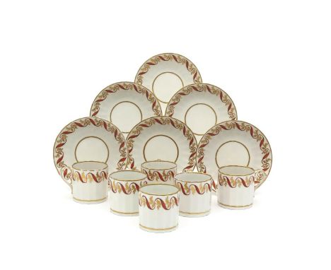 A set of six Derby coffee cans and saucers, c.1815, the fluted forms decorated with a wide border of orange ribbon interlaced