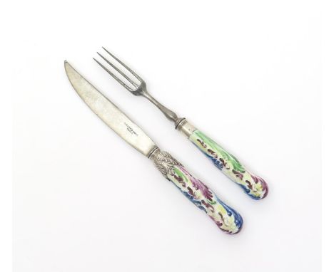 A knife and fork with Bow porcelain handles, c.1760, the straight hafts with feather moulding, enamelled in green, puce and b