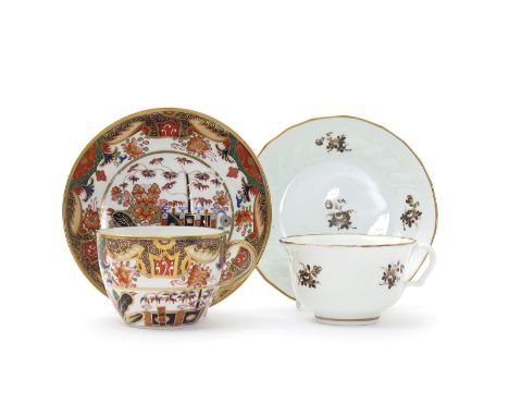 A Spode cup and saucer, c.1820-30, richly decorated in pattern 967 with an Oriental landscape in the Imari palette, and a Swa