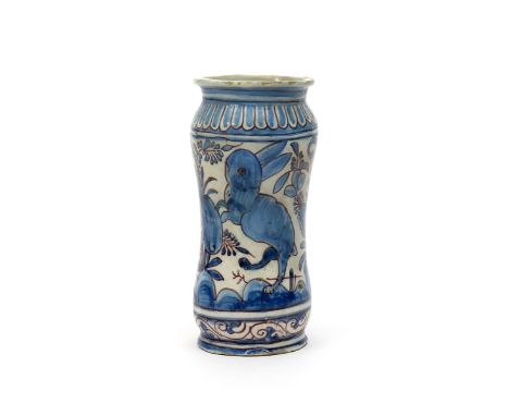 A Portuguese faïence drug jar, c.1625-50, of waisted albarello form, painted in blue and manganese with a large rabbit betwee