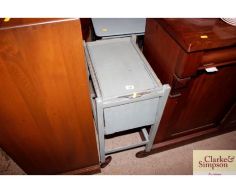 A painted vintage trolley with drop flaps and removable tray