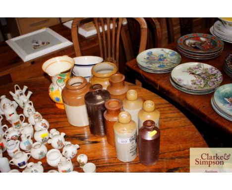 A quantity of stone glazed ginger beer bottles; two storage jars; an Art Deco design jug etc.
