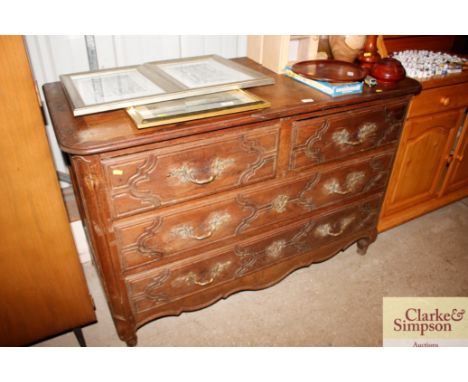 An ornate 19th Century oak French commode