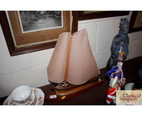 An Art Deco lamp in the form of a yacht 