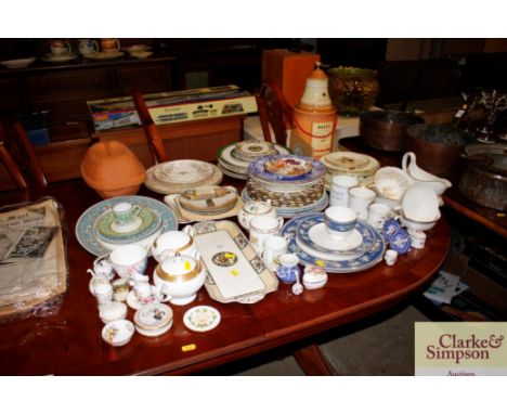 A large quantity of various decorative tea and dinnerware to include Wedgwood, Royal Crown Derby, a Bells Wade whisky decante