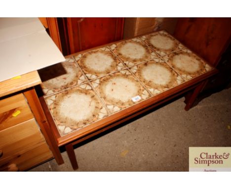A teak G-plan style coffee table with tile inset top
