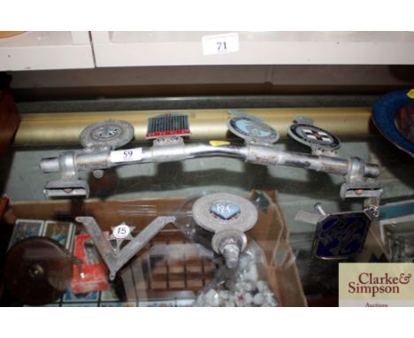 Seven vintage chrome and enamel decorated car badges 