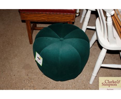 An emerald green velvet footstool / pouffe