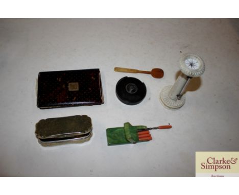 A box containing a plated 19th Century snuff box with inscription; an ivory cased compass barometer; a card case etc.