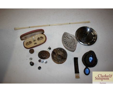 An Art Deco style long cigarette holder; a white metal filigree work box; cased cuff-links etc.