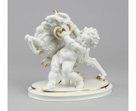 Hutschenreuther - Figur "Übermut"Porzellan gold staffiert, Putto mit Ziegenbock auf ovaler, gestufter Plinthe, rückseitig gep