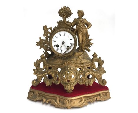 A gilt metal and ormolu mounted mantel clock on wooden stand, roman numerals to dial, 34cmH 