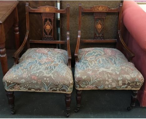 A pair of Edwardian occasional with satinwood marquetry inlays, raised on turned legs and ceramic casters 