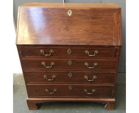 A George III mahogany bureau, fall front and fitted interior over four long graduating drawers, on bracket feet 