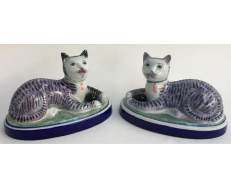 A pair of ceramic seated cats 