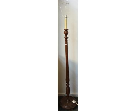 A turned standard lamp with candle effect light fitting, the base 150cmH 