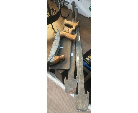 A pair of vintage tile rippers, together with a vintage saw and rasp 