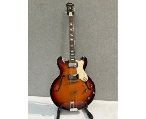 An Epiphone Riviera VC semi-acoustic electric guitar, sunburst body, hole to reverse and some splitting to neck joint, serial