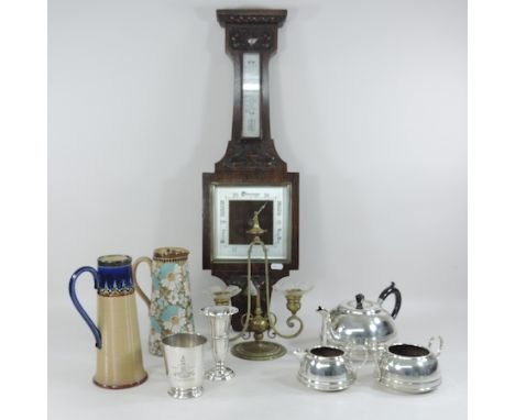 A Doulton Lambeth stoneware jug, together with another, a brass candlestick and an oak cased barometer, tallest 72cm