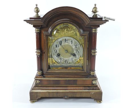 An early 20th century walnut cased bracket clock with a brass dial, 36cm tall
