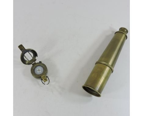 A brass telescope, together with a marching compass