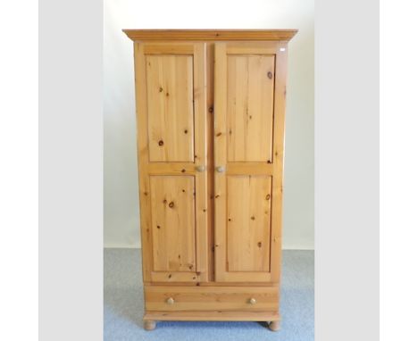 A pine double wardrobe, 98cm, together with a wall mirror and a print