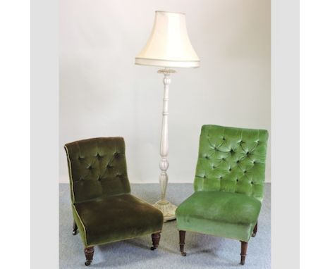 A Victorian green upholstered button back nursing chair, together with another and a white painted standard lamp and shade