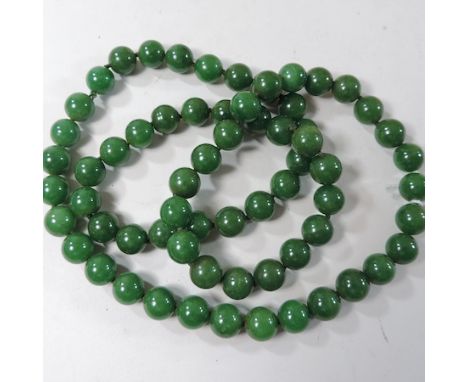 A jade coloured bead necklace