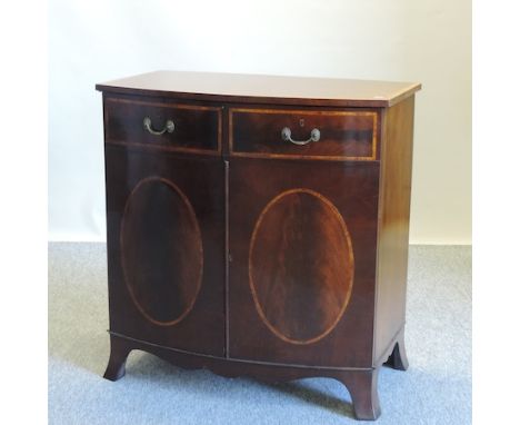 A George III style mahogany and inlaid bow front cabinet, on swept bracket feet, 89cm