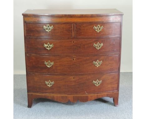 A Regency mahogany and inlaid bow front chest, containing two short over three long drawers, on swept bracket feet, 145cm