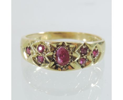 An 18 carat gold and ruby gypsy ring, boxed