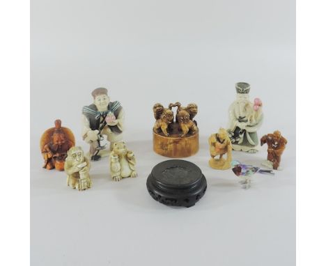A collection of netsuke and miniature carvings, tallest 9cm
