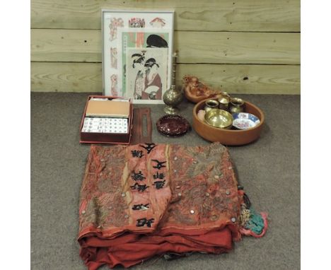 A box of oriental items, to include carvings, brassware, embroidered textiles and paper cuts, framed