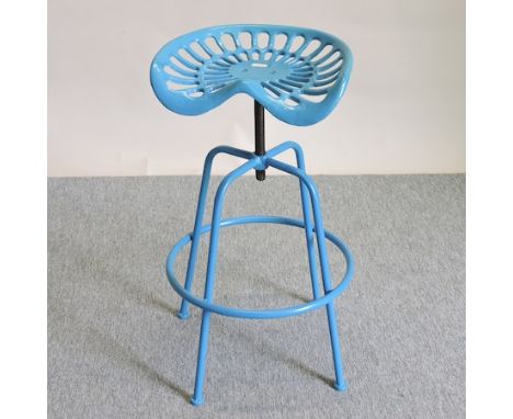 A blue painted metal tractor seat bar stool