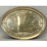 GEORGE V SILVER OVAL TRAY, repousse decoration of trailing vines and flowers, London 1910, William