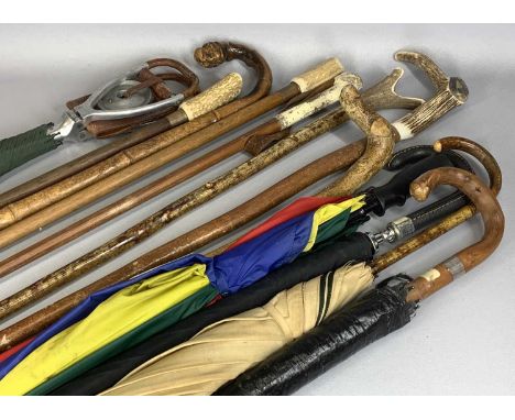COLLECTION OF WALKING STICKS, UMBRELLAS & OTHER ITEMS including a shooting stick, some of the walking sticks with antler hand