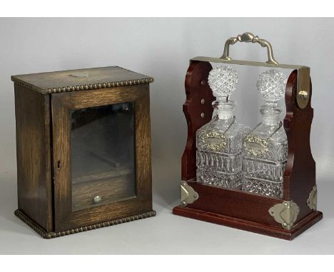 EDWARDIAN OAK SMOKER'S CABINET, the top mounted with a plated shield, glazed single door enclosing interior with drawer, 27cm