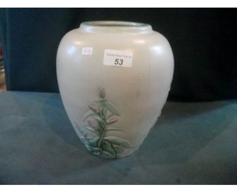 A Denby earthenware vase of ovoid form, decorated in shallow relief with mauve flowers and green foliage, on a light grey gro
