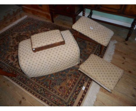 A contemporary gout stool, together with two footstools and a pouffe, each with floral trellis upholstery.