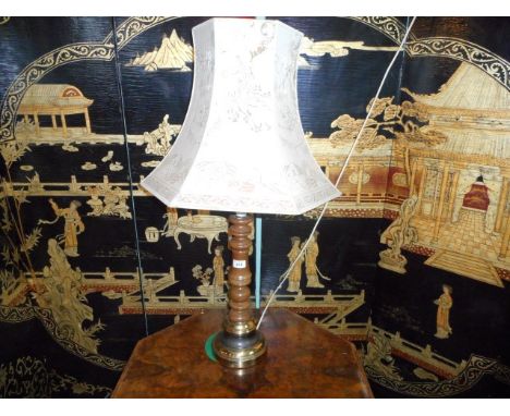 A turned wood and brass table lamp with florally printed cloth shade, 90cm (total).