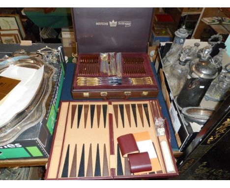 A simulated leather briefcase containing a twelve place setting of gilded nickel steel flatware and cutlery, together with a 