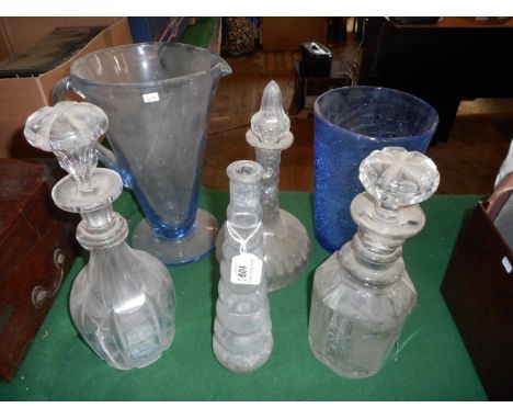 Three late Victorian/Edwardian decanters and stoppers, together with a hand blown blue crackle glass vase, a ribbed clear gla